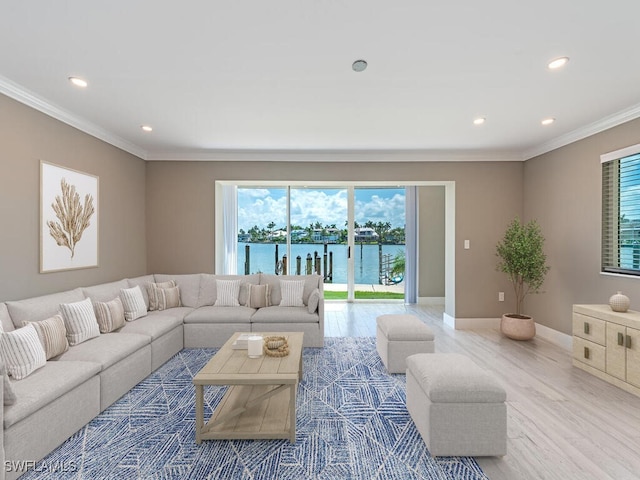 2500 Gulf Shore Blvd N Unit S9, Naples, FL 34103 - living area featuring ornamental molding, healthy amount of natural light, recessed lighting, wood finished floors, and a water view