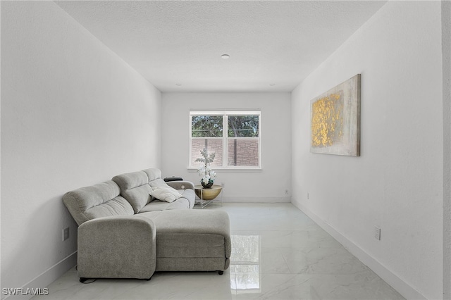 4868 Chisholm Park Trl, Saint Cloud, FL 34771 - sitting room featuring light marble finish flooring and a textured ceiling