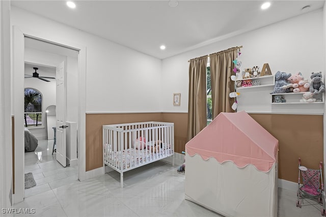 4868 Chisholm Park Trl, Saint Cloud, FL 34771 - bedroom featuring a nursery area, recessed lighting, and marble look tiles