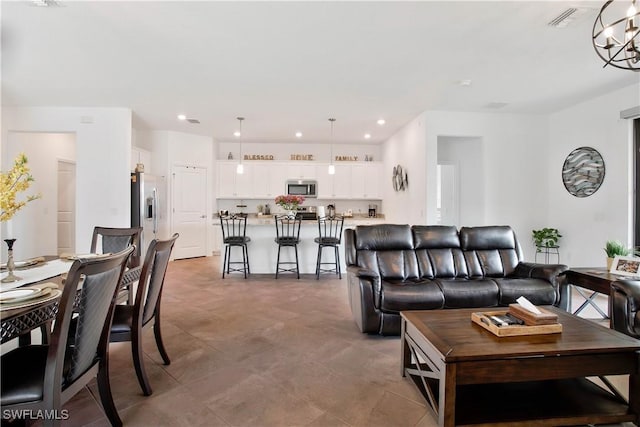 3440 Menores Way, Fort Myers, FL 33905 - living room featuring recessed lighting and a chandelier