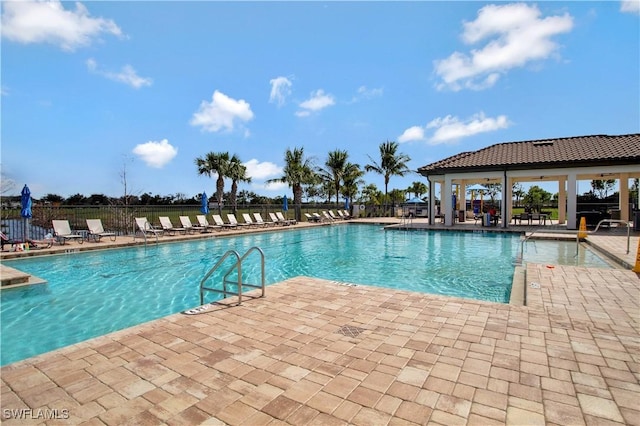 3440 Menores Way, Fort Myers, FL 33905 - community pool featuring a patio area