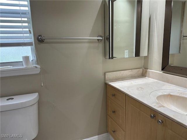 4620 Parrot Ave, Naples, FL 34104 - half bath featuring vanity and toilet