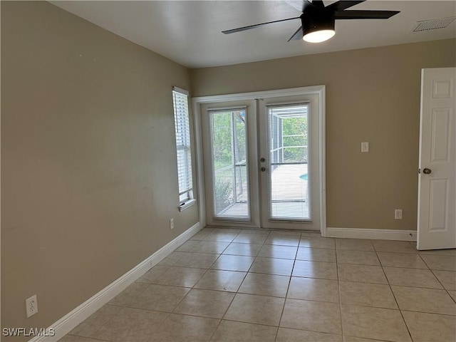 4620 Parrot Ave, Naples, FL 34104 - doorway to outside with ceiling fan, french doors, and light tile patterned floors