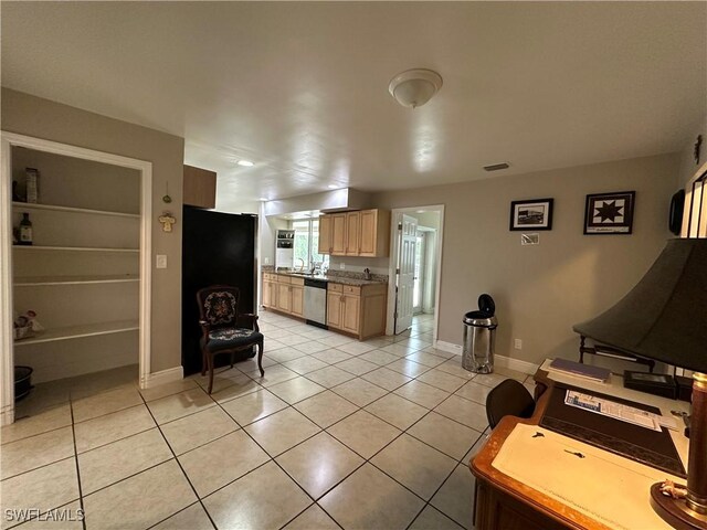 4620 Parrot Ave, Naples, FL 34104 - kitchen featuring dishwasher, light tile patterned floors, light brown cabinetry, and freestanding refrigerator