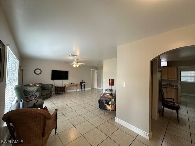 4620 Parrot Ave, Naples, FL 34104 - living room featuring arched walkways, light tile patterned flooring, and ceiling fan