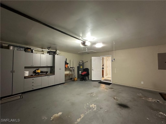 4620 Parrot Ave, Naples, FL 34104 - garage featuring a garage door opener, water heater, and electric panel