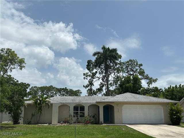 4620 Parrot Ave, Naples, FL 34104 - ranch-style home with stucco siding, driveway, and an attached garage