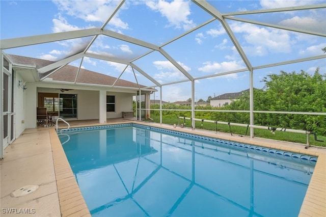 3213 22nd St SW, Lehigh Acres, FL 33976 - outdoor pool featuring a patio, ceiling fan, and glass enclosure