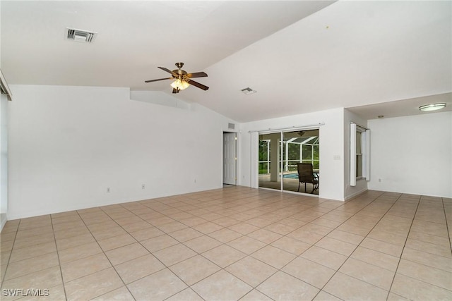 3213 22nd St SW, Lehigh Acres, FL 33976 - spare room featuring vaulted ceiling, ceiling fan, and light tile patterned floors