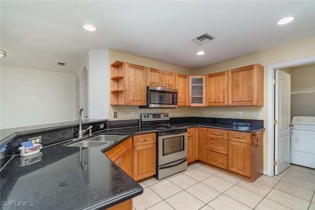 3213 22nd St SW, Lehigh Acres, FL 33976 - kitchen with stainless steel appliances, washer / clothes dryer, open shelves, light tile patterned floors, and recessed lighting