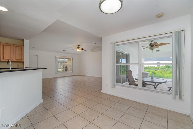 3213 22nd St SW, Lehigh Acres, FL 33976 - unfurnished living room with a ceiling fan, light tile patterned floors, and lofted ceiling