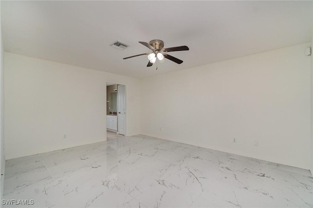 3213 22nd St SW, Lehigh Acres, FL 33976 - unfurnished room featuring a ceiling fan and light marble finish flooring
