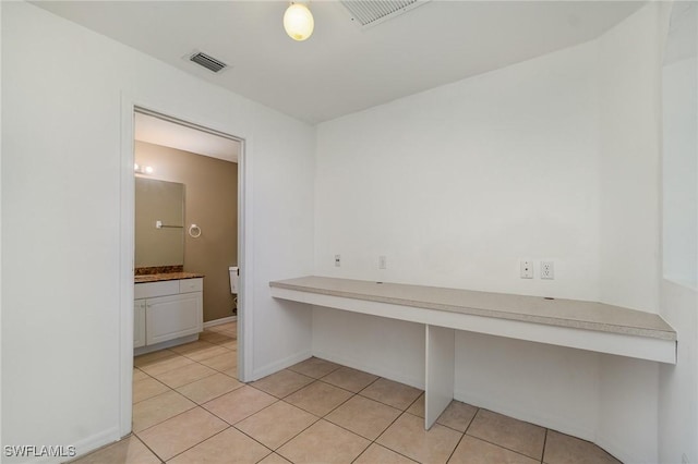 3213 22nd St SW, Lehigh Acres, FL 33976 - unfurnished office featuring light tile patterned floors and baseboards
