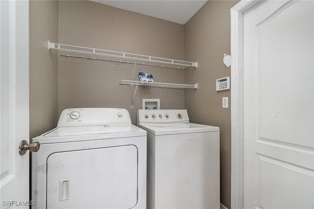 3213 22nd St SW, Lehigh Acres, FL 33976 - washroom with washing machine and clothes dryer