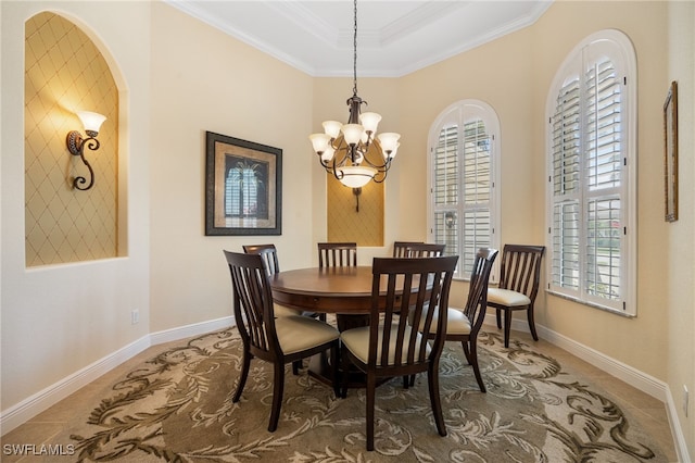 19332 La Serena Dr, Estero, FL 33967 - dining space featuring a chandelier, ornamental molding, and arched walkways