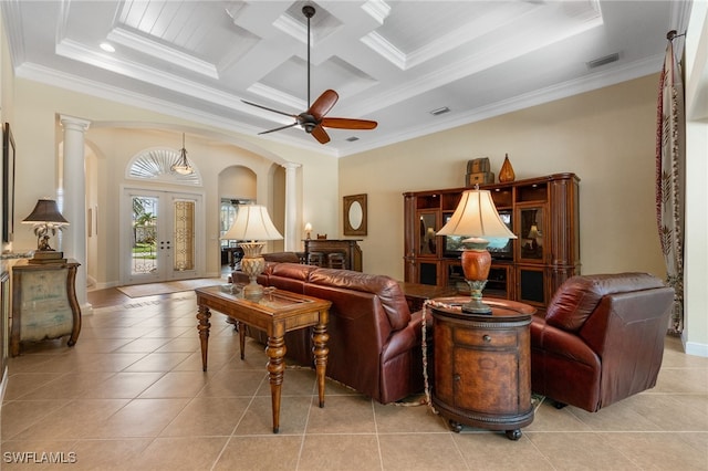 19332 La Serena Dr, Estero, FL 33967 - living area with decorative columns, crown molding, light tile patterned flooring, ceiling fan, and arched walkways