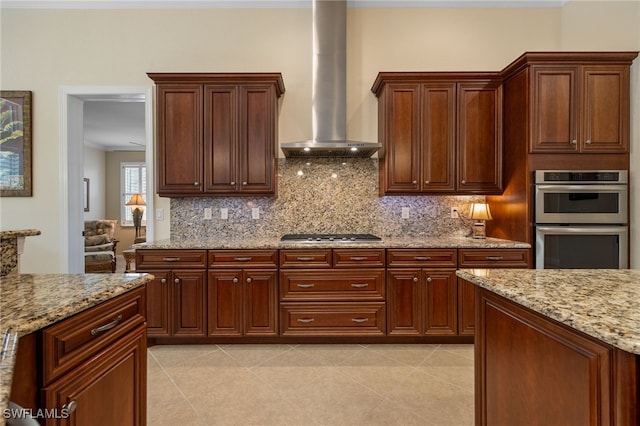 19332 La Serena Dr, Estero, FL 33967 - kitchen with wall chimney exhaust hood, appliances with stainless steel finishes, backsplash, light stone counters, and ornamental molding