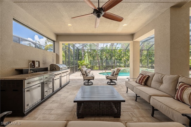 19332 La Serena Dr, Estero, FL 33967 - view of patio / terrace with an outdoor kitchen, an outdoor hangout area, an outdoor pool, a lanai, and ceiling fan