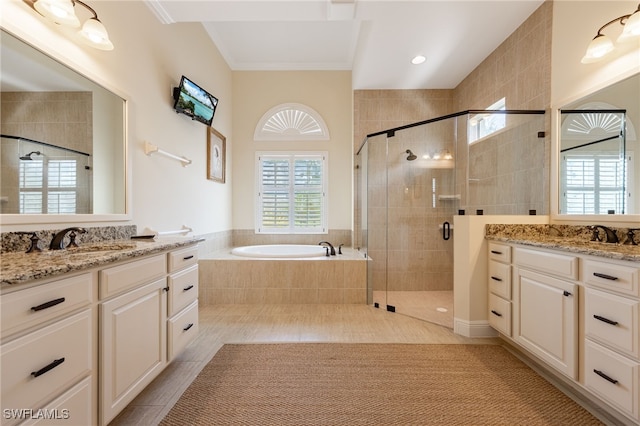 19332 La Serena Dr, Estero, FL 33967 - bathroom featuring two vanities, a shower stall, a bath, tile patterned flooring, and crown molding