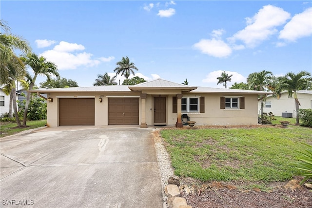 1120 Ridge St, Naples, FL 34103 - ranch-style house with concrete driveway, an attached garage, a front lawn, and stucco siding