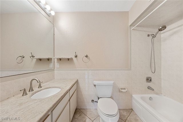 1120 Ridge St, Naples, FL 34103 - bathroom with vanity,  shower combination, a wainscoted wall, tile patterned flooring, and tile walls