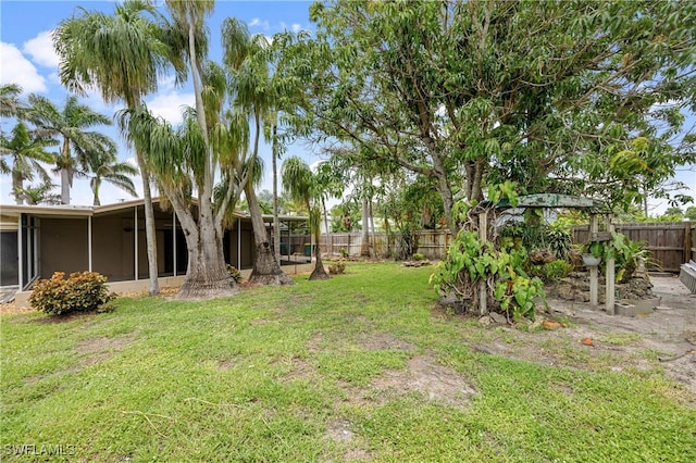 1120 Ridge St, Naples, FL 34103 - fenced backyard with a sunroom