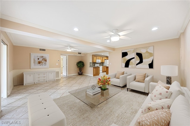 1120 Ridge St, Naples, FL 34103 - living room with ceiling fan, crown molding, recessed lighting, and light tile patterned flooring