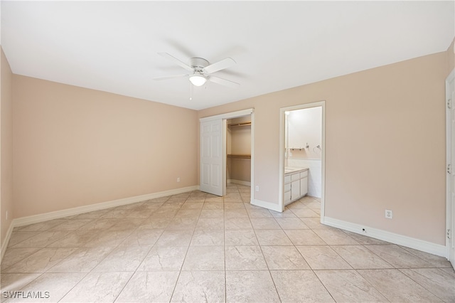 1120 Ridge St, Naples, FL 34103 - unfurnished bedroom featuring ceiling fan and connected bathroom