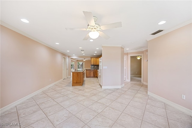 1120 Ridge St, Naples, FL 34103 - kitchen with a ceiling fan, ornamental molding, recessed lighting, a center island, and light countertops