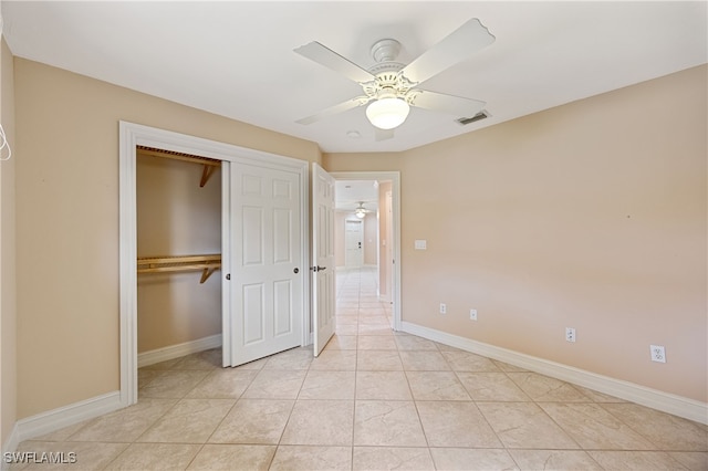 1120 Ridge St, Naples, FL 34103 - unfurnished bedroom with a closet, ceiling fan, and light tile patterned floors