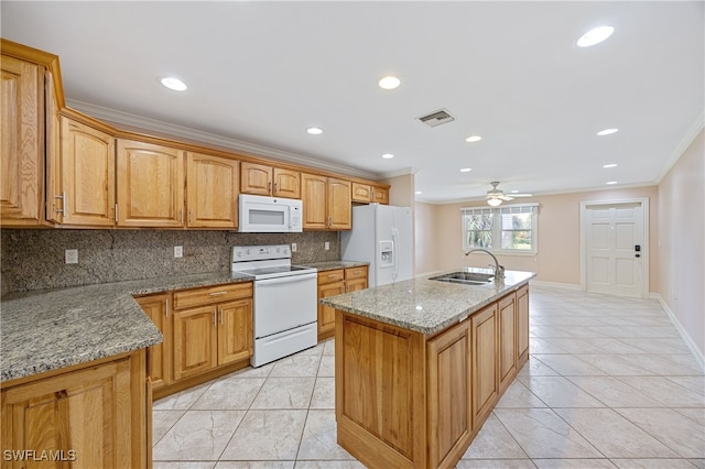1120 Ridge St, Naples, FL 34103 - kitchen featuring white appliances, ornamental molding, tasteful backsplash, light tile patterned floors, and a kitchen island with sink