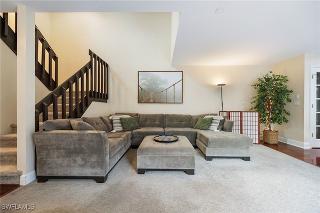 13660 Abbey Dr Unit 1, Fort Myers, FL 33919 - carpeted living room with stairway and baseboards