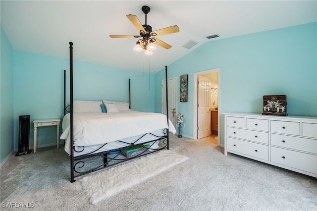 13660 Abbey Dr Unit 1, Fort Myers, FL 33919 - bedroom with lofted ceiling, light colored carpet, connected bathroom, and ceiling fan