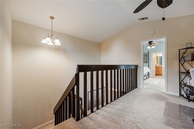 13660 Abbey Dr Unit 1, Fort Myers, FL 33919 - hall featuring carpet, vaulted ceiling, an upstairs landing, and a chandelier