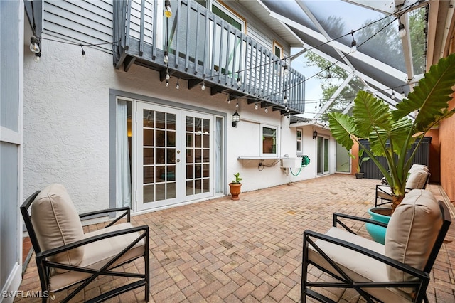 13660 Abbey Dr Unit 1, Fort Myers, FL 33919 - view of patio / terrace featuring french doors