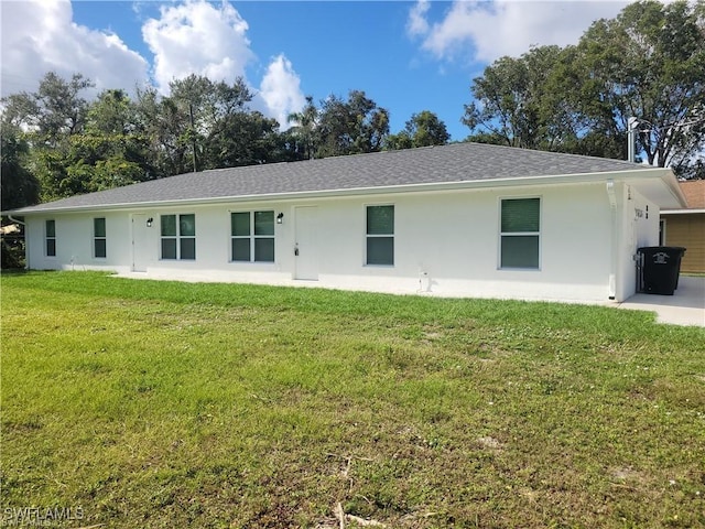 2154/2156 Edison Ave, Fort Myers, FL 33901 - view of front of house with a front lawn, stucco siding, and roof with shingles