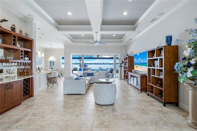 9380 Slate Ct, Naples, FL 34120 - living area featuring a ceiling fan, crown molding, stone tile floors, coffered ceiling, and a bar
