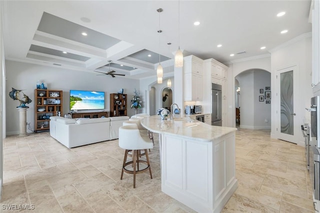 9380 Slate Ct, Naples, FL 34120 - kitchen featuring arched walkways, stainless steel built in fridge, a ceiling fan, a peninsula, and coffered ceiling