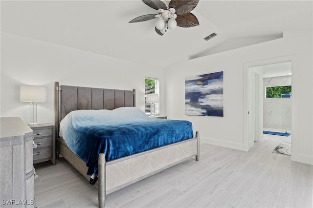 2050 Terrazzo Ln, Naples, FL 34104 - bedroom featuring lofted ceiling, light wood-style flooring, a ceiling fan, and ensuite bathroom