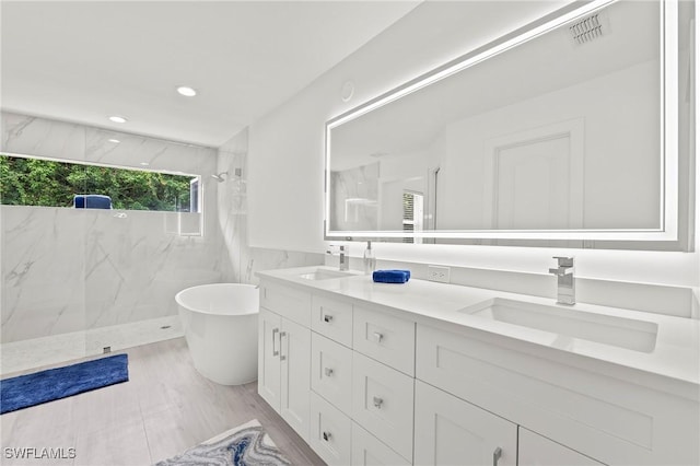 2050 Terrazzo Ln, Naples, FL 34104 - full bath featuring double vanity, a marble finish shower, a soaking tub, and recessed lighting