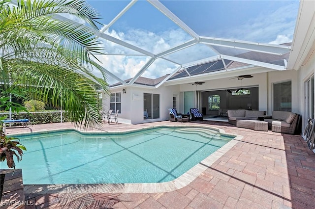 2050 Terrazzo Ln, Naples, FL 34104 - outdoor pool featuring an outdoor living space, a ceiling fan, a patio area, and glass enclosure