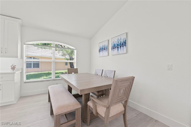 2050 Terrazzo Ln, Naples, FL 34104 - dining space with vaulted ceiling and light wood-type flooring