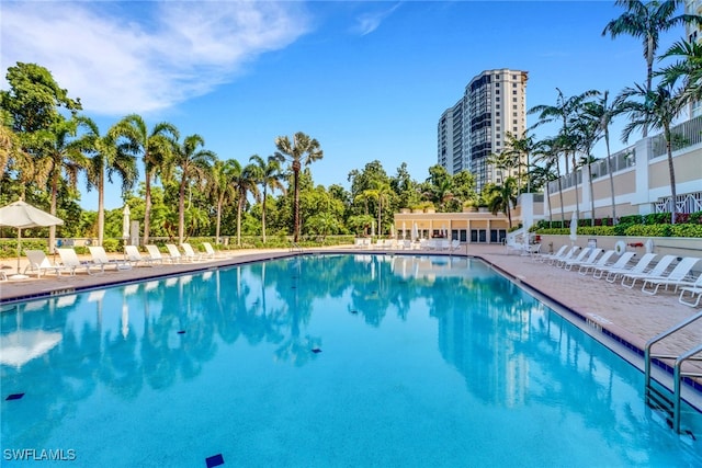 7117 Pelican Bay Blvd Unit 1801, Naples, FL 34108 - community pool with a patio area