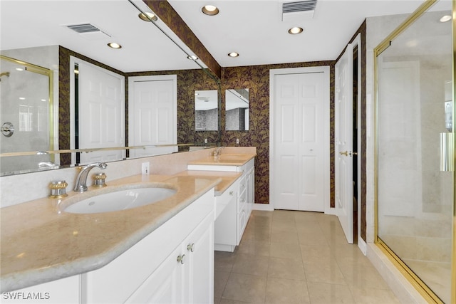 7117 Pelican Bay Blvd Unit 1801, Naples, FL 34108 - full bath with vanity, a stall shower, tile patterned flooring, wallpapered walls, and recessed lighting