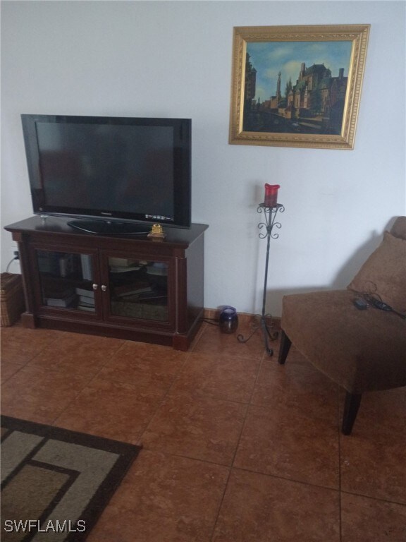 340 Easton Ct, Lehigh Acres, FL 33936 - living area with tile patterned flooring