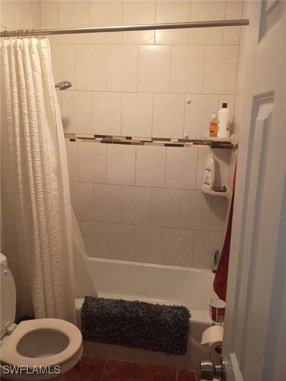 340 Easton Ct, Lehigh Acres, FL 33936 - full bathroom featuring toilet and shower / bath combo with shower curtain