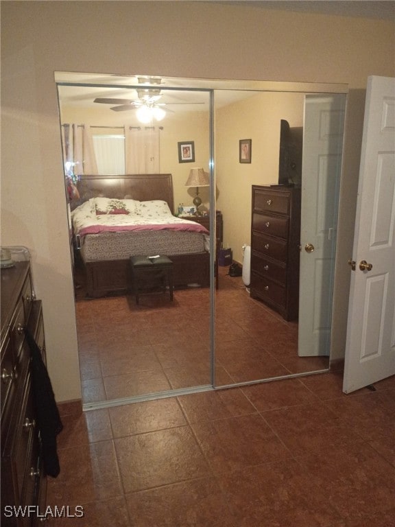 340 Easton Ct, Lehigh Acres, FL 33936 - bedroom featuring a closet, dark tile patterned flooring, and ceiling fan