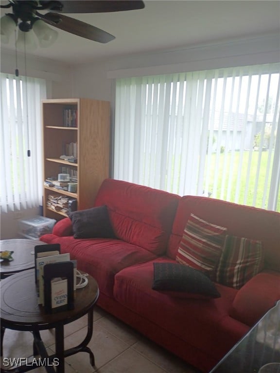 340 Easton Ct, Lehigh Acres, FL 33936 - living room featuring plenty of natural light, light tile patterned floors, and ceiling fan