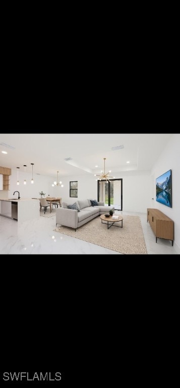 340 Easton Ct, Lehigh Acres, FL 33936 - living area with a chandelier