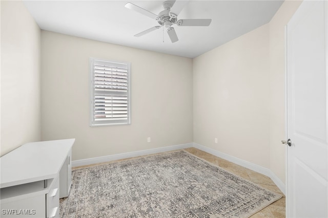 15140 Palmer Lake Cir Unit 201, Naples, FL 34109 - spare room with a ceiling fan and baseboards